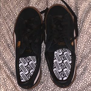 Black and brown puma sneakers